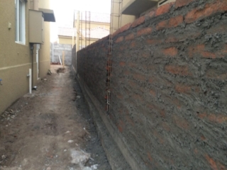 Construcción de muro medianero en ladrillo